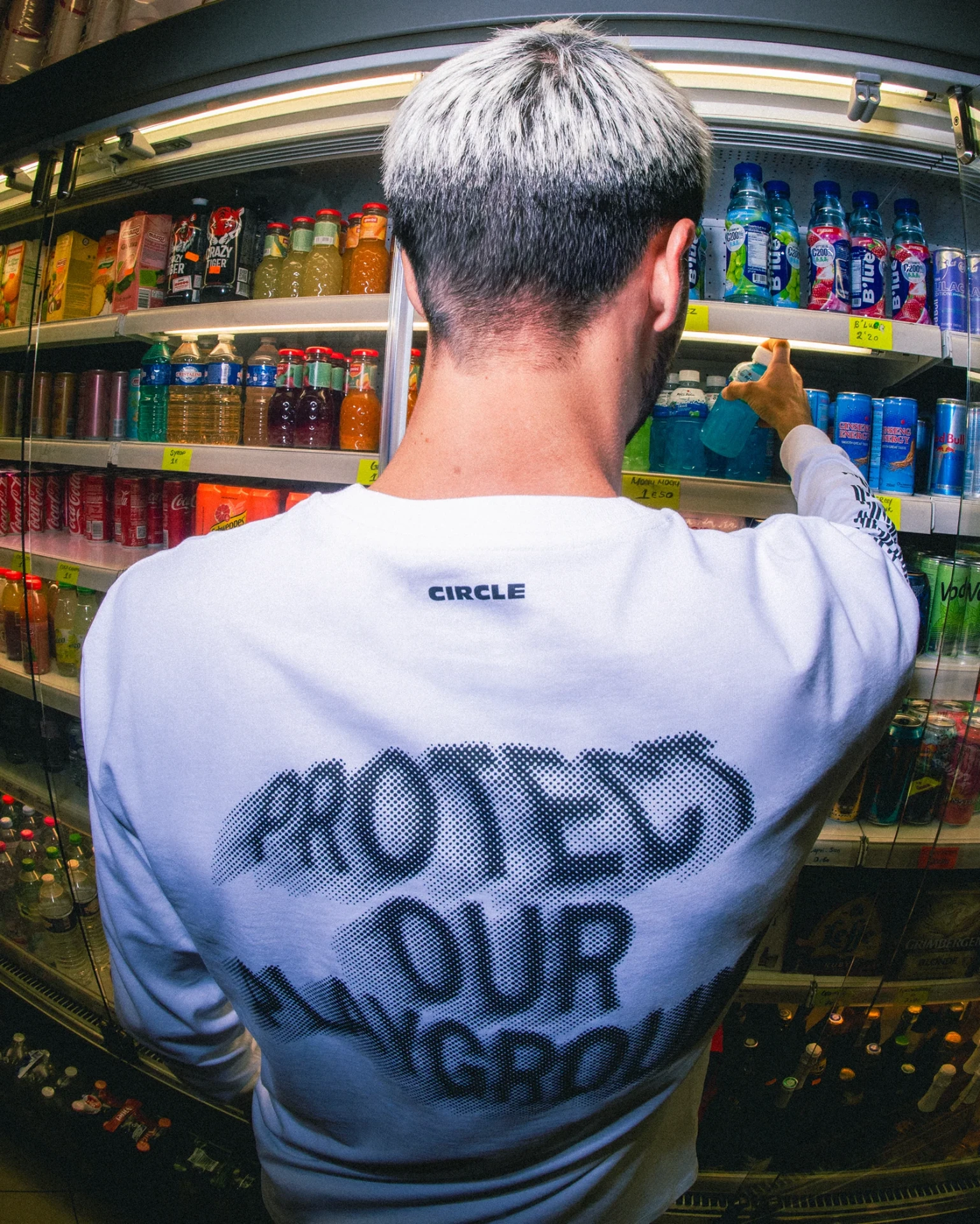 Circle Sportswear long sleeve tee worn in a corner shop